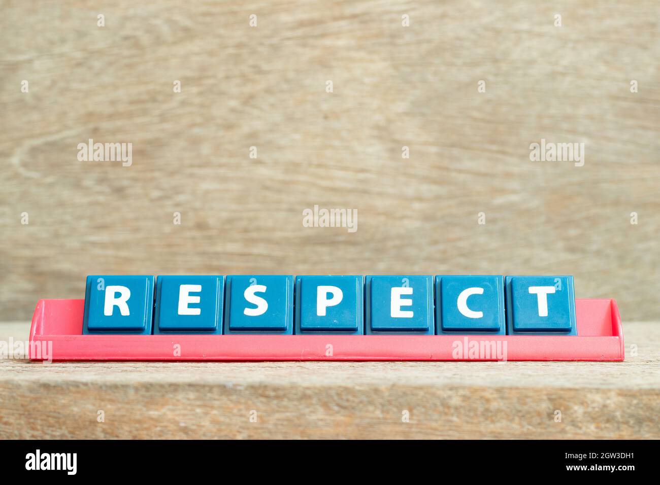 Tile alphabet letter with word respect in red color rack on wood ...