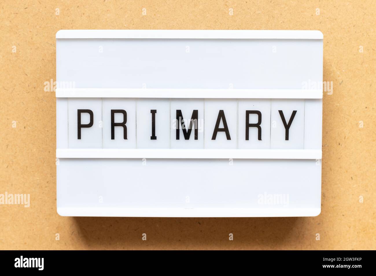Lightbox with word primary on wood background Stock Photo