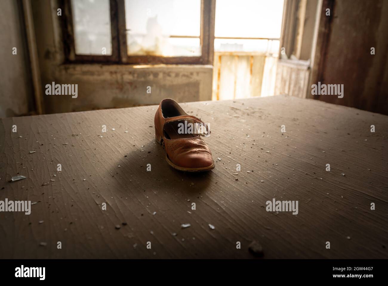 Girl Shoe left behind in a living apartment in Pripyat - Pripyat, Chernobyl Exclusion Zone, Ukraine Stock Photo