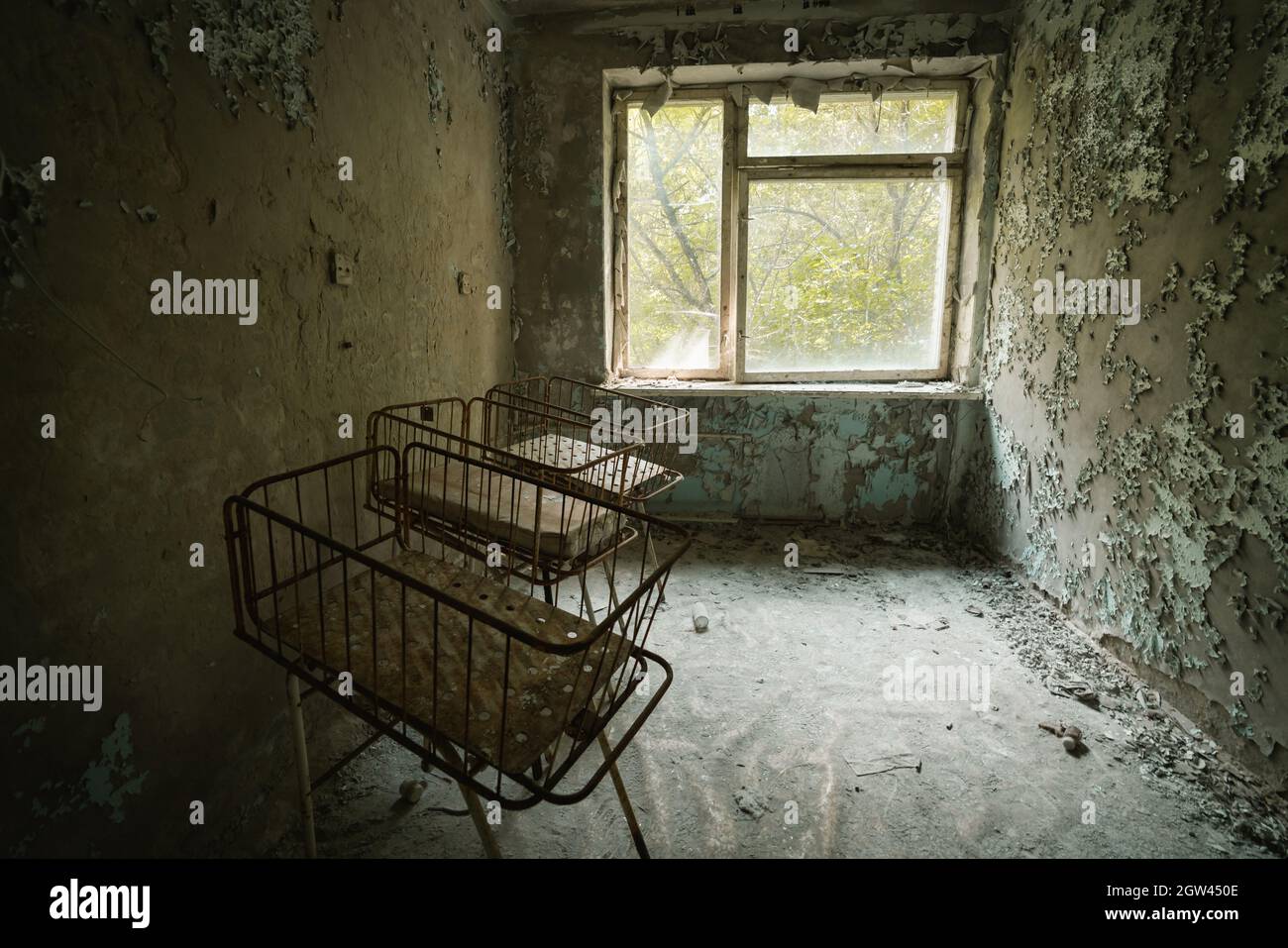 Cribs at the Nursery of Pripyat Hospital - Pripyat, Chernobyl Exclusion Zone, Ukraine Stock Photo