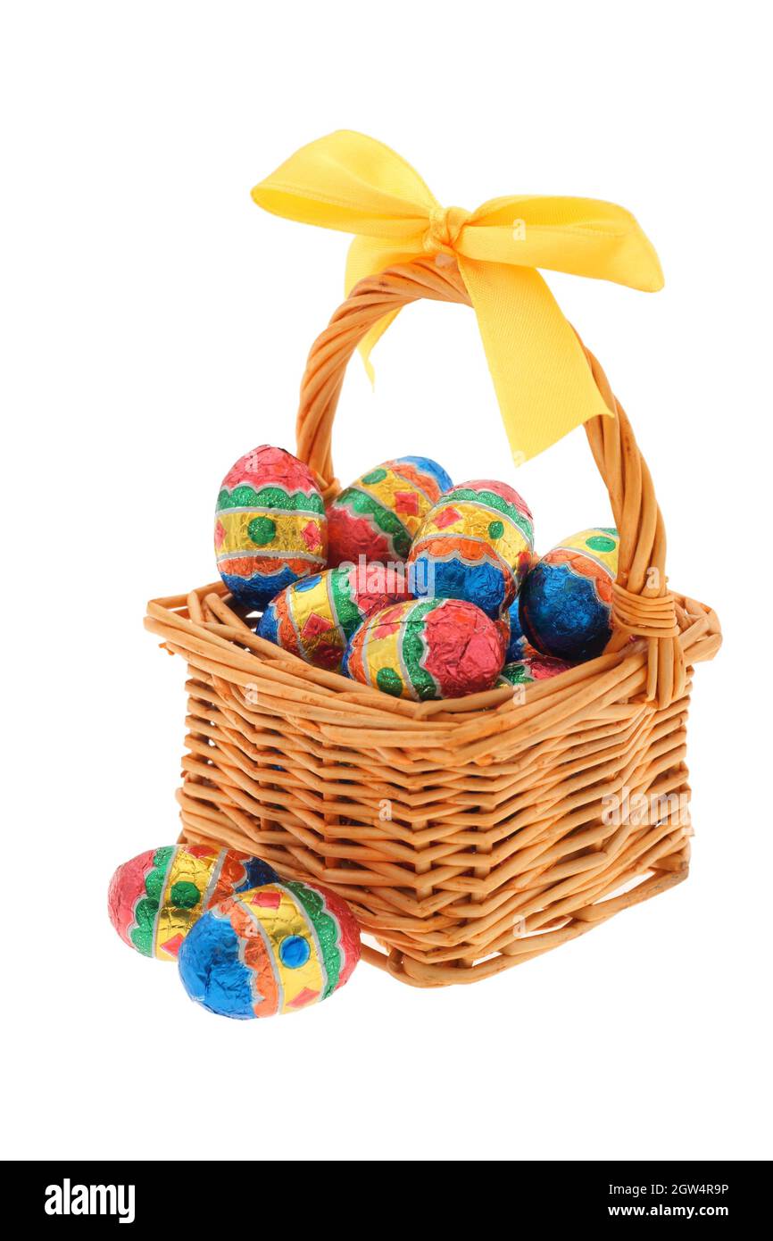 Close-up Of Colorful Easter Eggs In Wicker Basket Against White Background Stock Photo