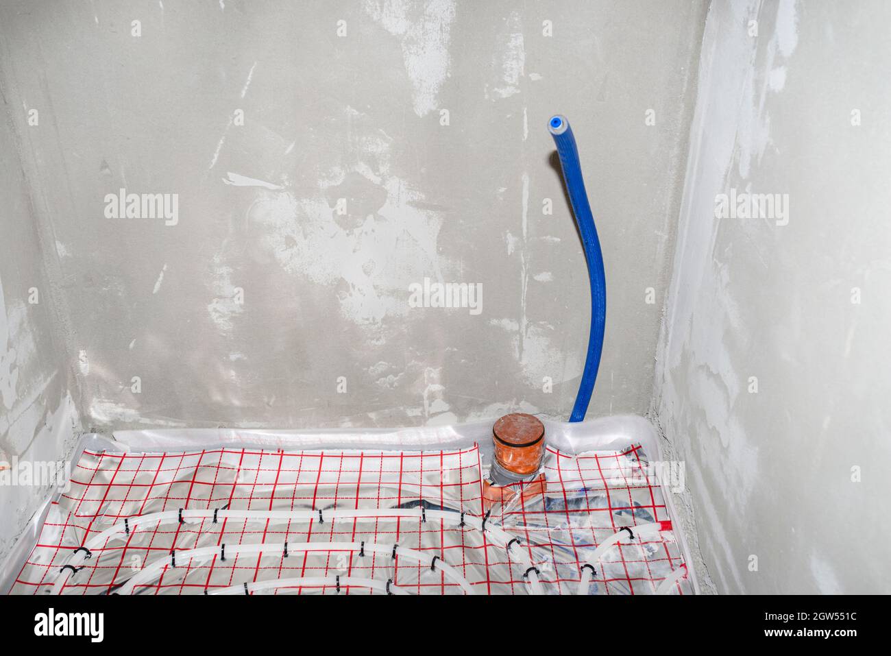 Blue Plastic Pipe With Cold Water Coming Out Of The Floor, Water Connection To The Toilet Cistern. Stock Photo