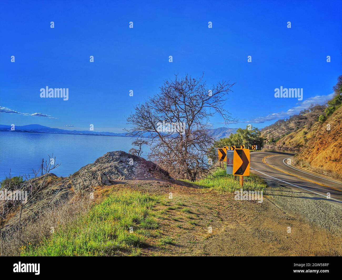 Traveling Mountain Highway Against Lake. Curve In The Road. Stock Photo
