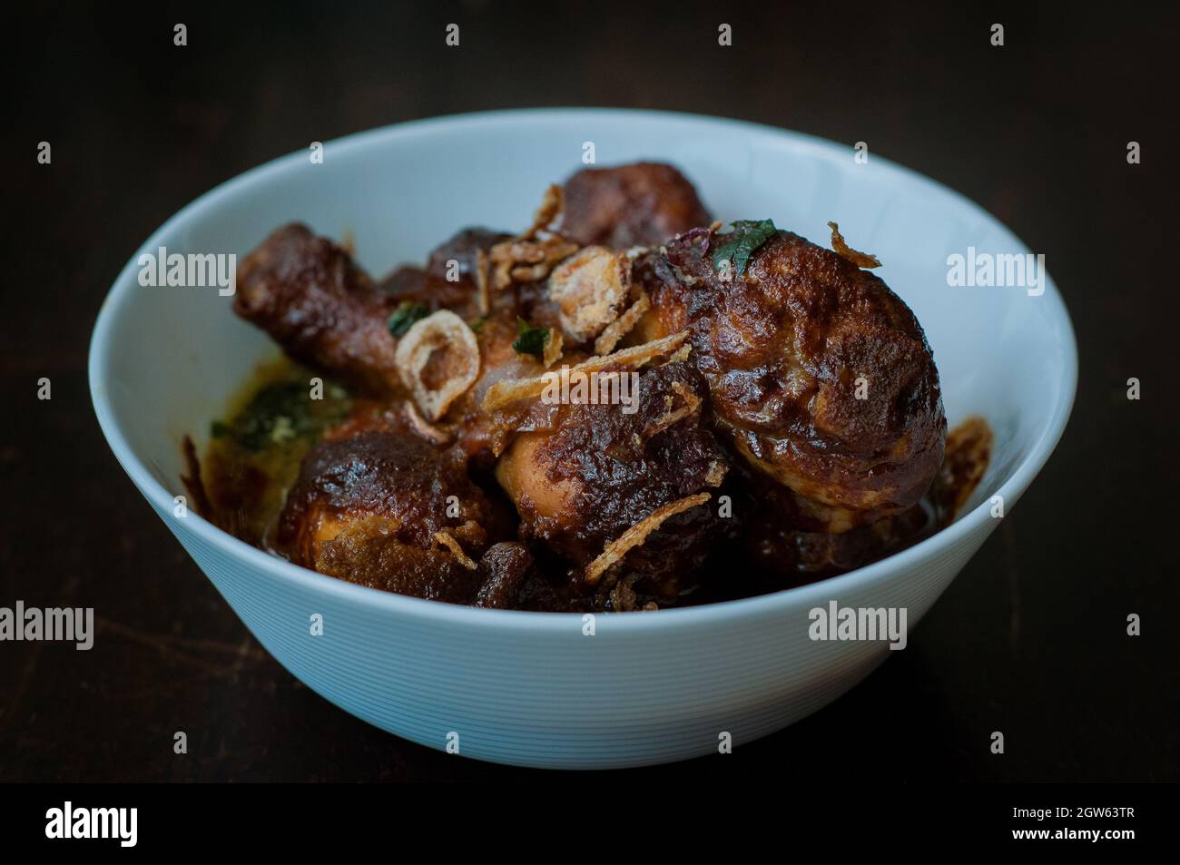 Malaysian Dish Of Ayam Masak Kicap Or Deep Fried Chicken In Black Soy Gravy In A White Bowl Stock Photo Alamy