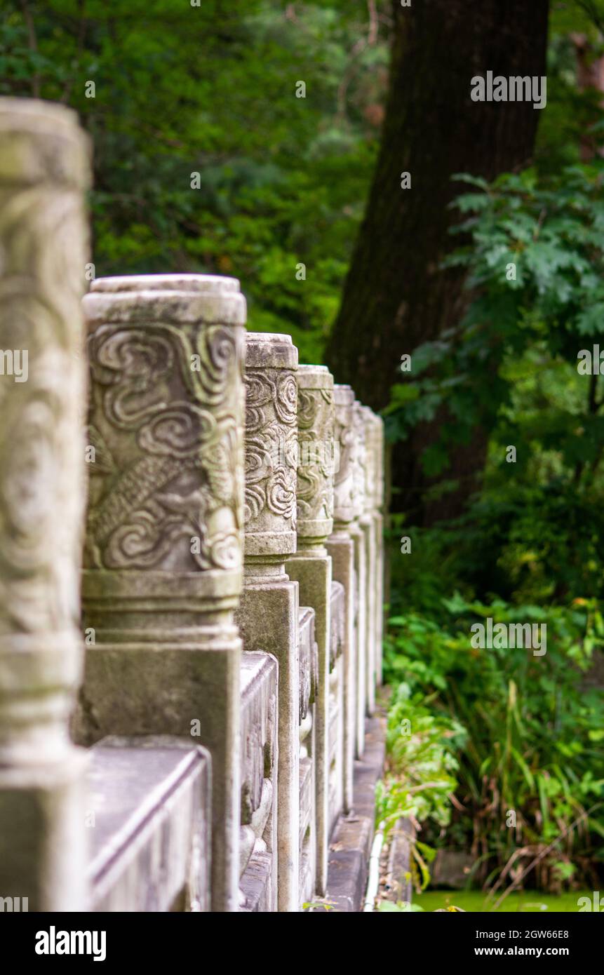 An old stone balcony on a blurry forest background Stock Photo - Alamy