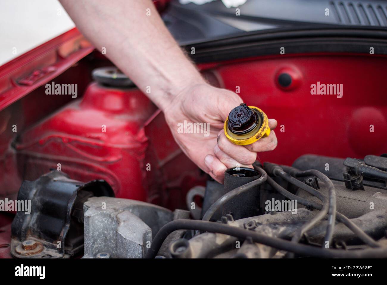 Raised The Hood Of The Car, Trying To Master Detects A Failure, Check The Engine Oil Stock Photo