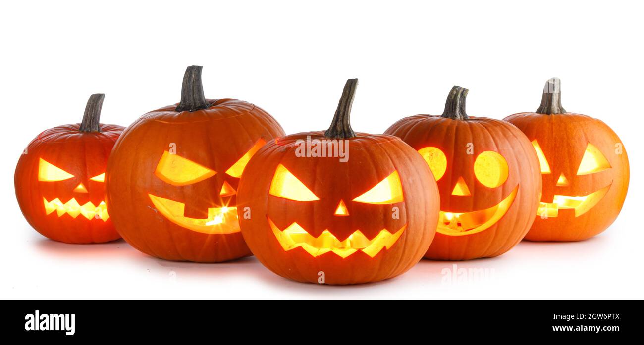 Five glowing Halloween Pumpkin lanterns isolated on white background ...
