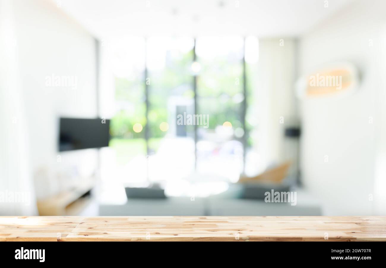 Wooden Board Empty Table In Front Of Blurred Background. Wood Over Blur In  Living Room Interior Stock Photo - Alamy