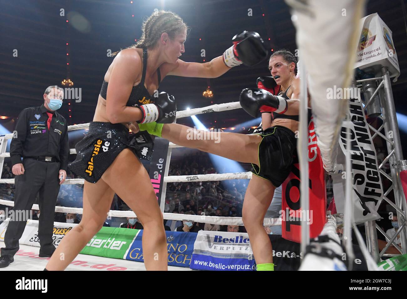 Munich, Germany. 02nd Oct, 2021. The kickboxers Marie Lang (l) and Ilda  Lelo fight in the Circus Krone Bau at Stekos Fight Night for the WKU World  Championship Kickboxing Lowkick. Lang won