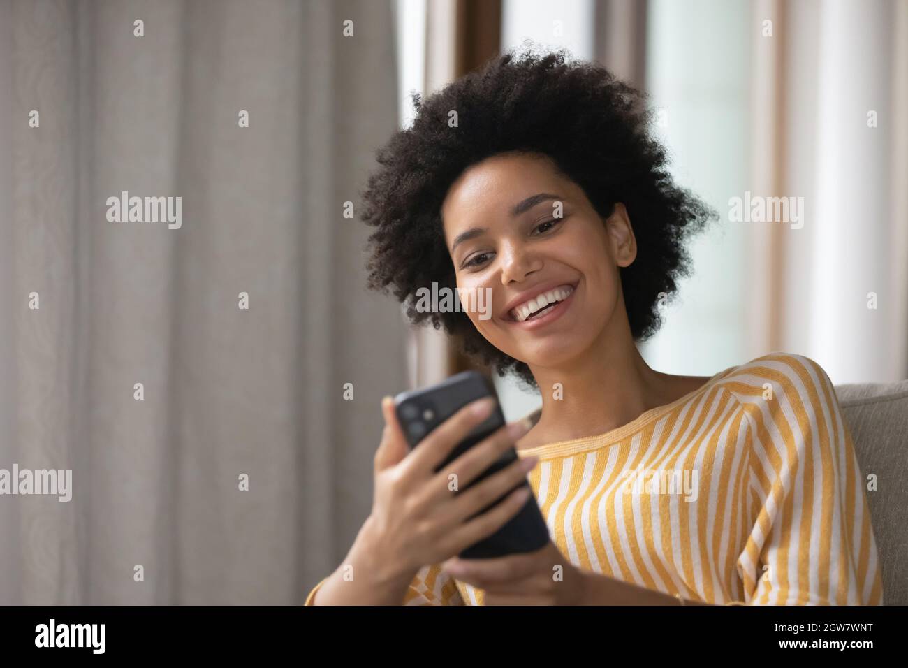 Happy biracial young woman hi-res stock photography and images - Alamy