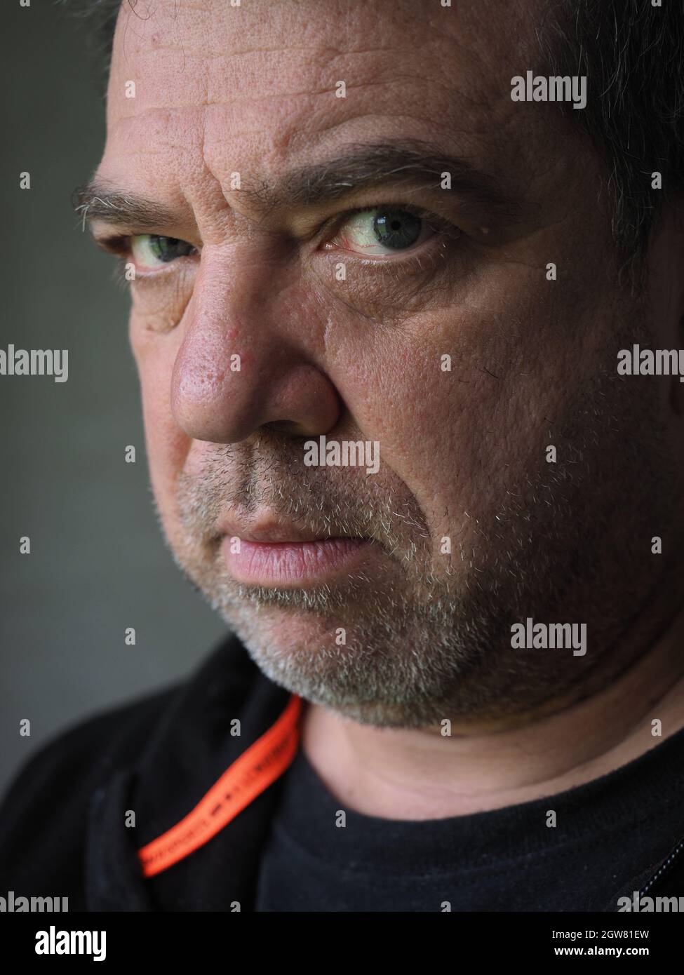 Close-up Portrait Of Serious Man Stock Photo