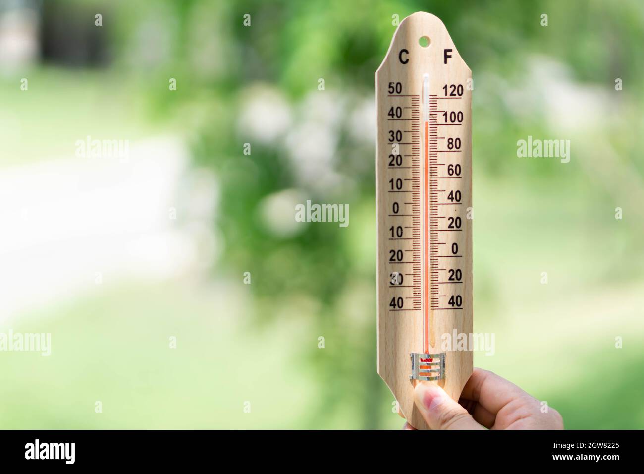Cropped Hand Holding Thermometer Stock Photo