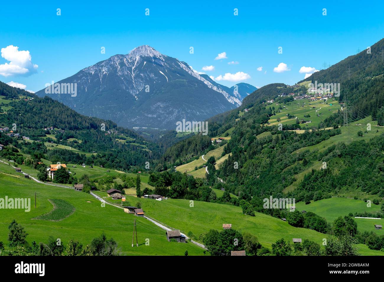 Scenic View Of Landscape And Mountains Against Sky Stock Photo