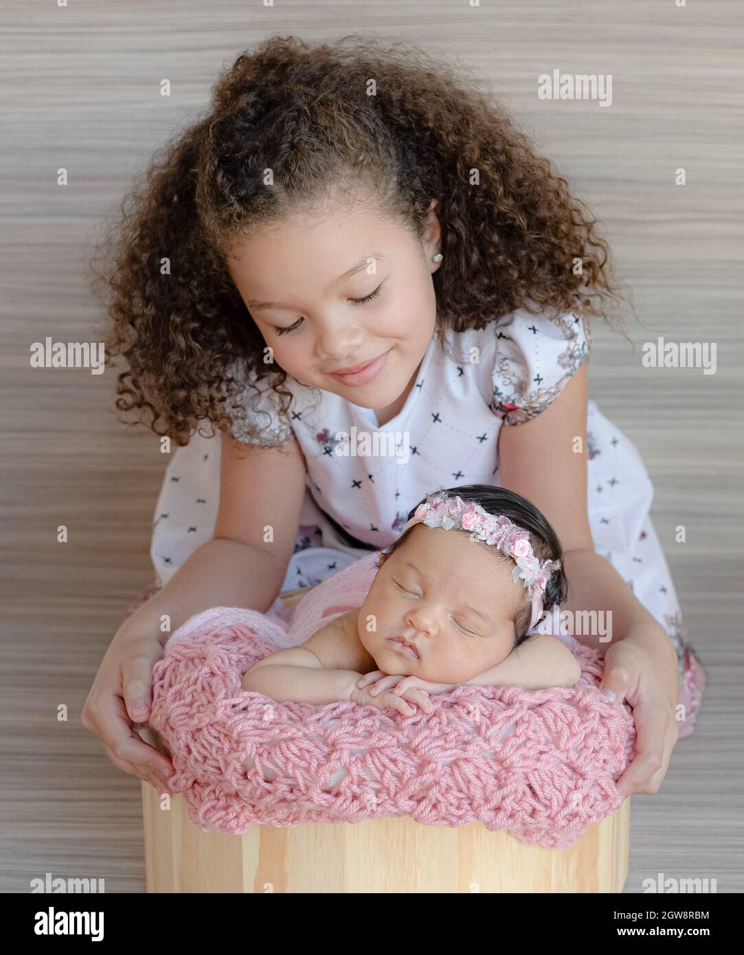 Portrait Of Cute Newborn With A 6 Years Old Sister Stock Photo