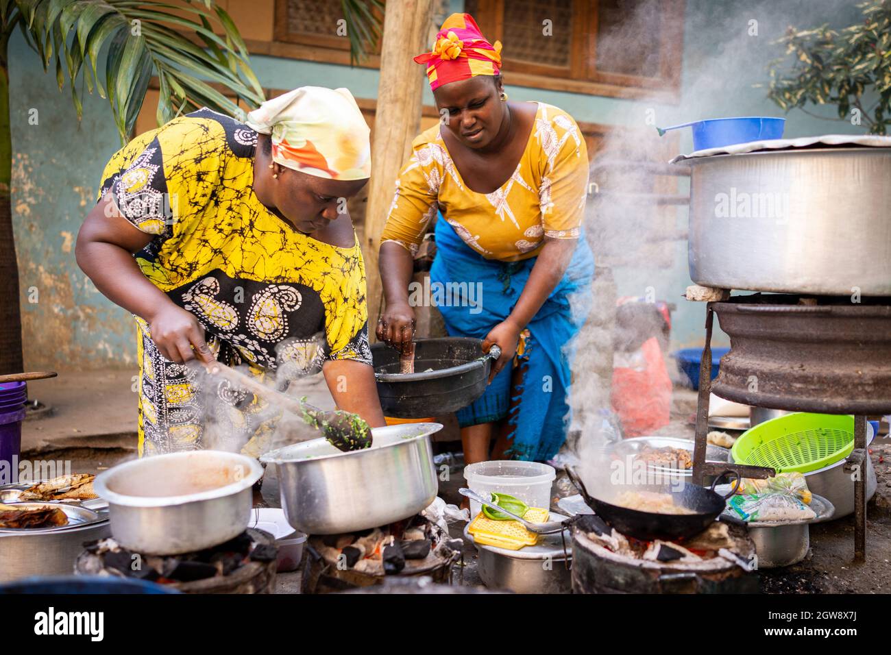 African woman cooking traditional food at street Stock Photo Alamy