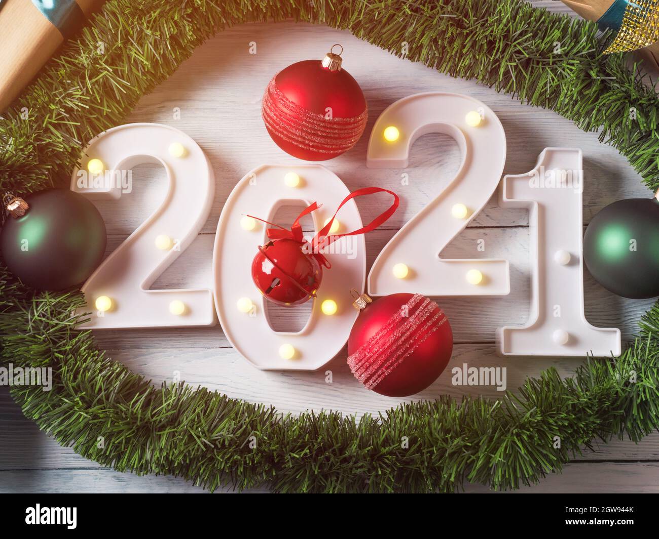 New Year Red And Green Decor Frame With Numbers 2021 On White Wooden Table With Golden Lights Stock Photo Alamy