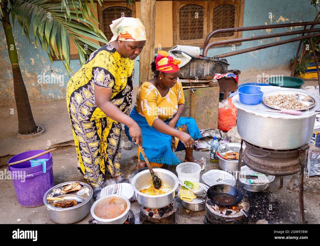African woman cooking traditional food at street Stock Photo Alamy