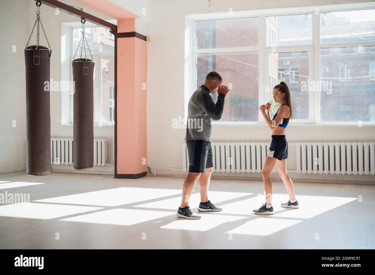 Female MMA fighter training punches technique Stock Photo Alamy