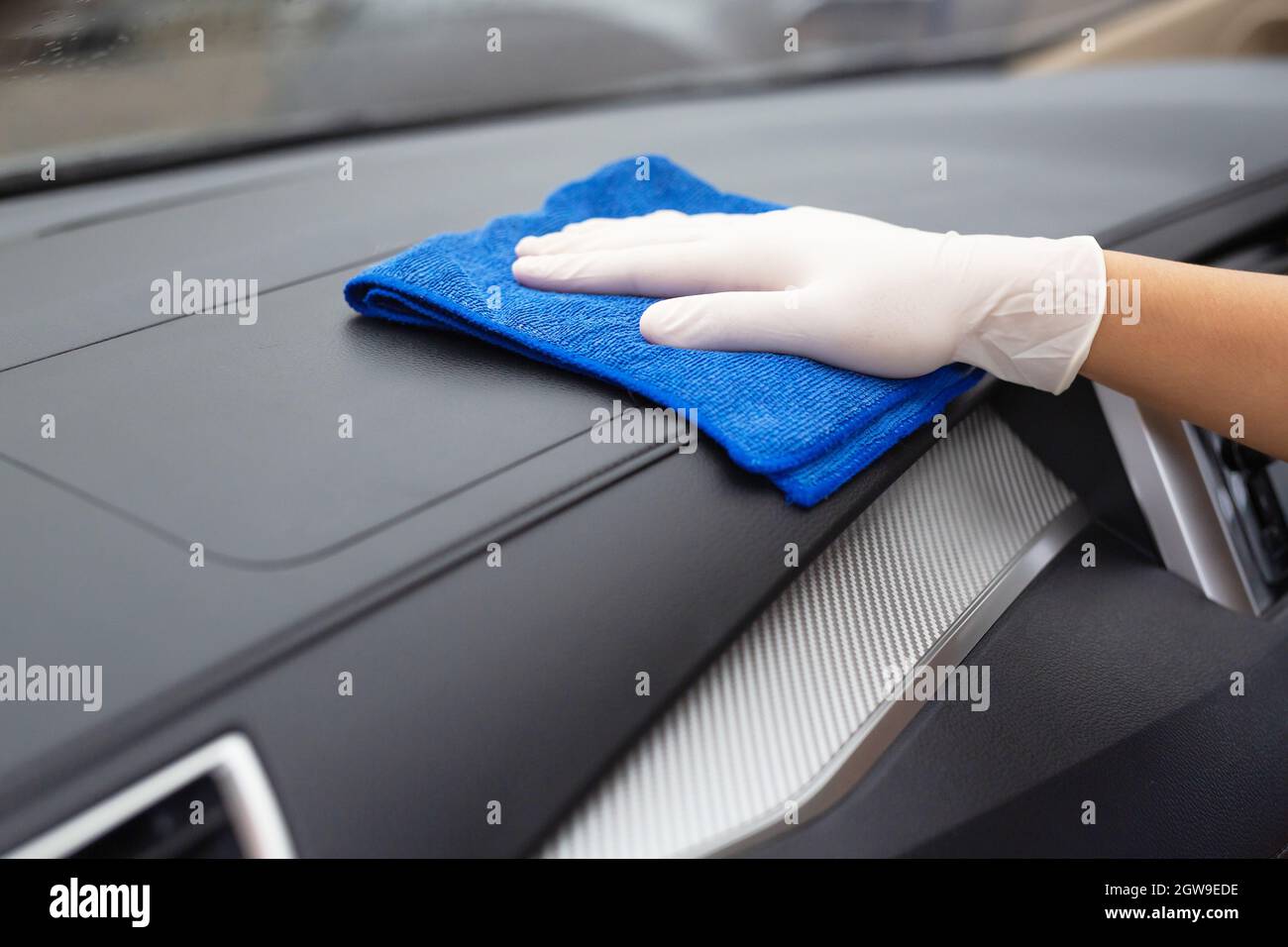 Car Care Workers Wash, Spray And Clean The Car. Stock Photo