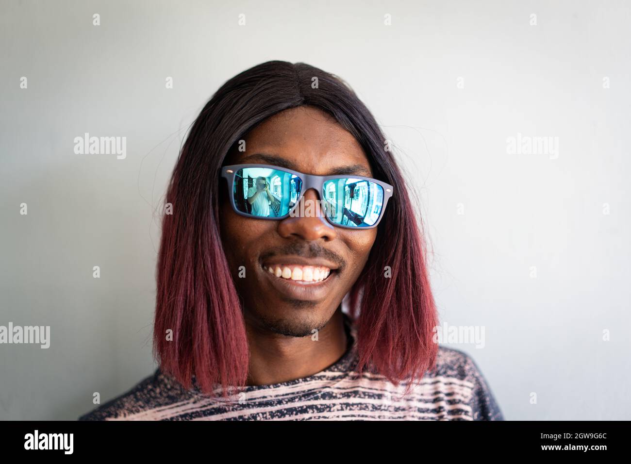 Funny black boy with long hair and sunglasses laughing Stock Photo Alamy