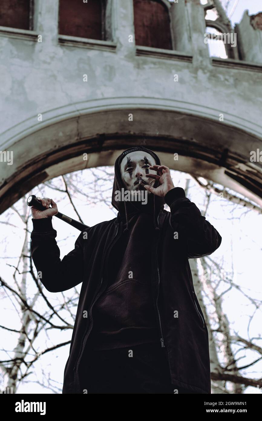 Portrait Of Man With Face Paint Smoking Cigarette Stock Photo Alamy