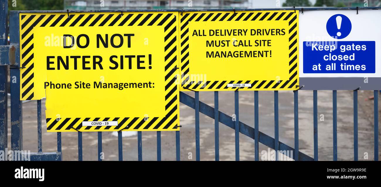 Do not enter construction in progress sign on fence Stock Photo