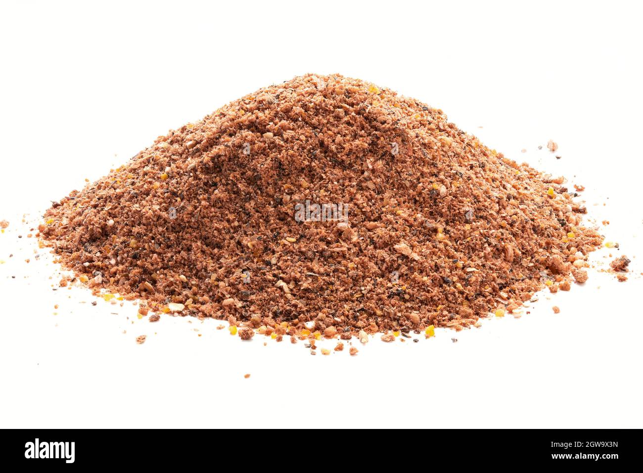 Pile of Nutmeg powder isolated on white background. Used as a spice in