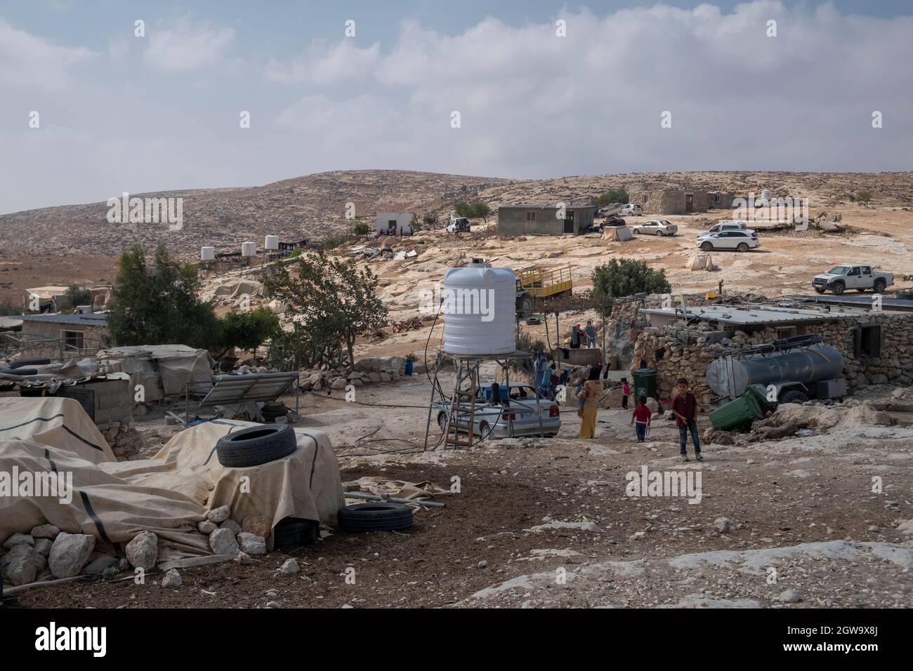 View of the Palestinian shepherding camp Khirbat al-Mufaqara located in the South Hebron Hills in the West Bank, Israel. For the past two decades, Israeli authorities have been trying to expel Palestinian living in the South Hebron Hills region, on the ground of living illegally in Israeli military fire zones. Residents and human rights groups have been petitioning for years against demolition orders and demanding to deliver water to Palestinian communities that are banned from connecting to the water grid. Stock Photo