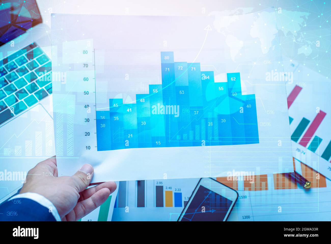 Digital Composite Image Of Businessman Holding Graph Stock Photo