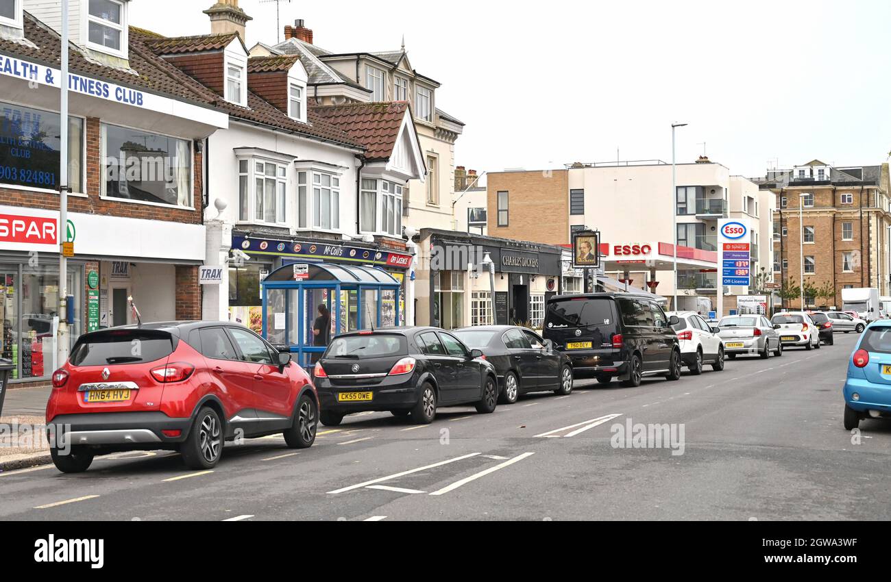 Worthing UK 3rd October 2021 -  Drivers queue to buy fuel at an Esso petrol station in Worthing this morning  : Credit Simon Dack / Alamy Live News Stock Photo