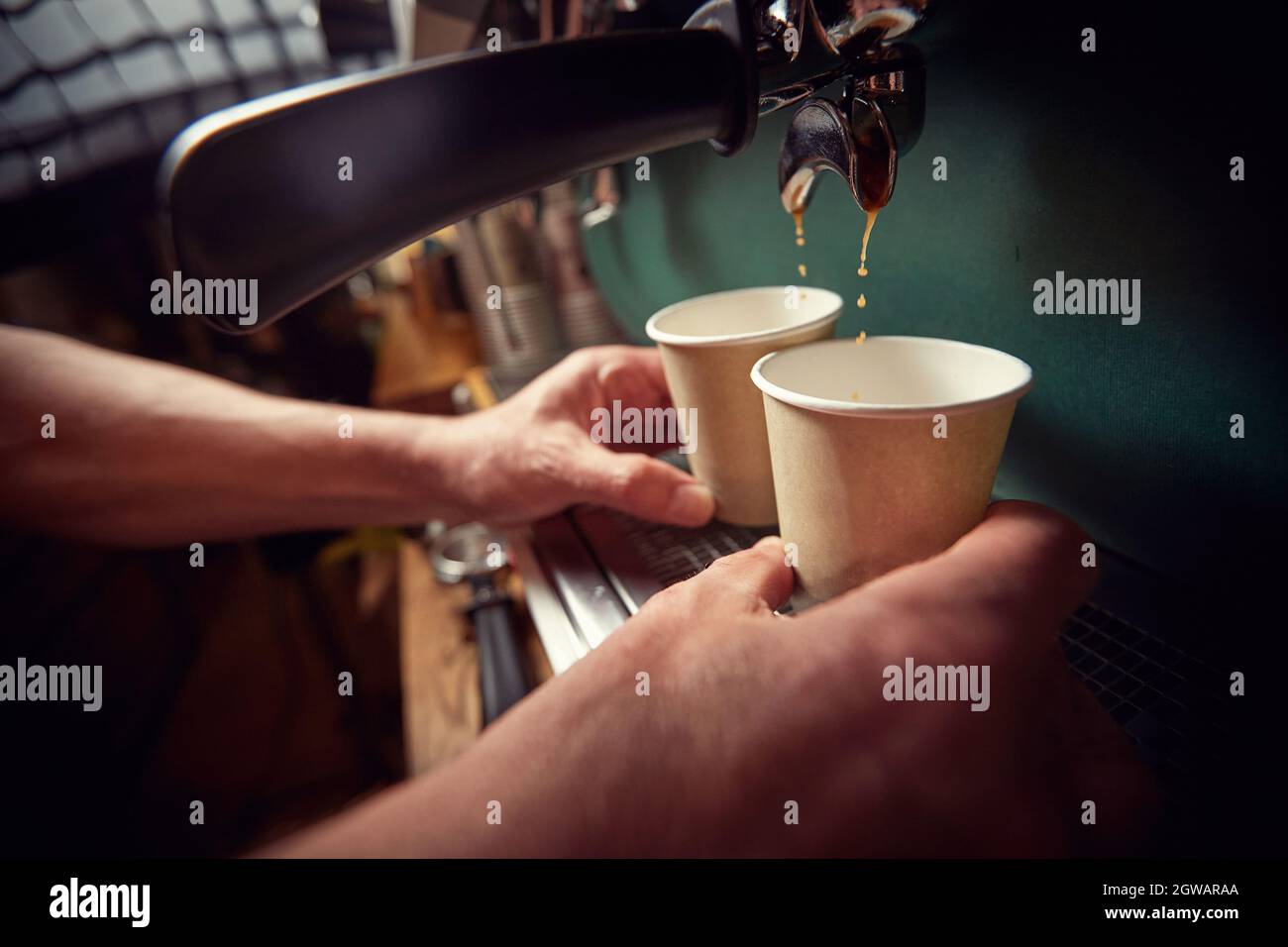 coffee cup to go.Fresh coffee pouring into cup. Stock Photo