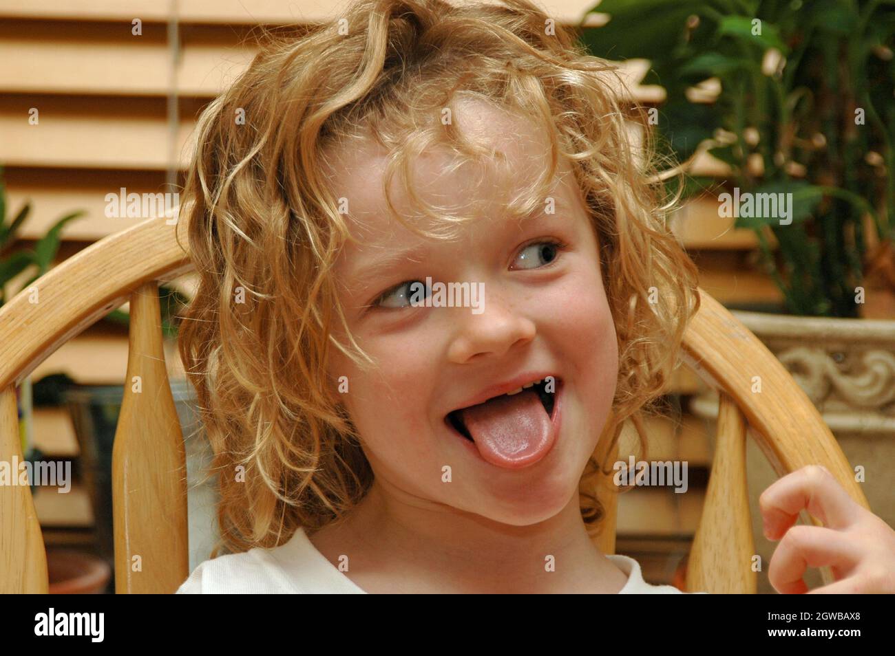 Close up of Young Girl with Tongue Out Stock Photo