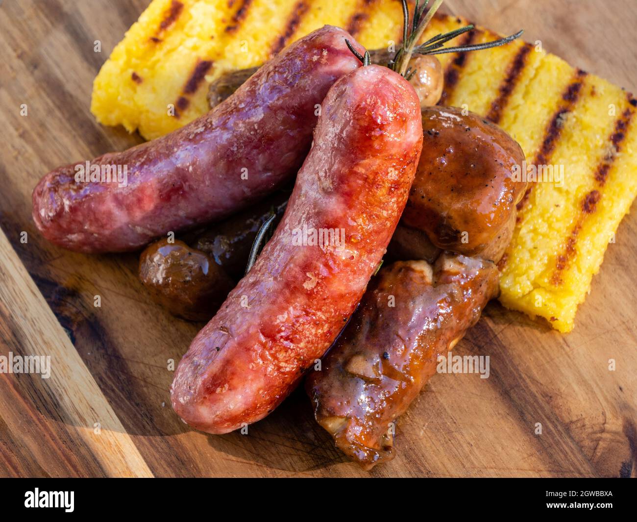 Salsiccia Italian Sausage with Sauteed Funghi Porcini or Cep Mushrooms and Grilled Polenta Close Up Detail Stock Photo