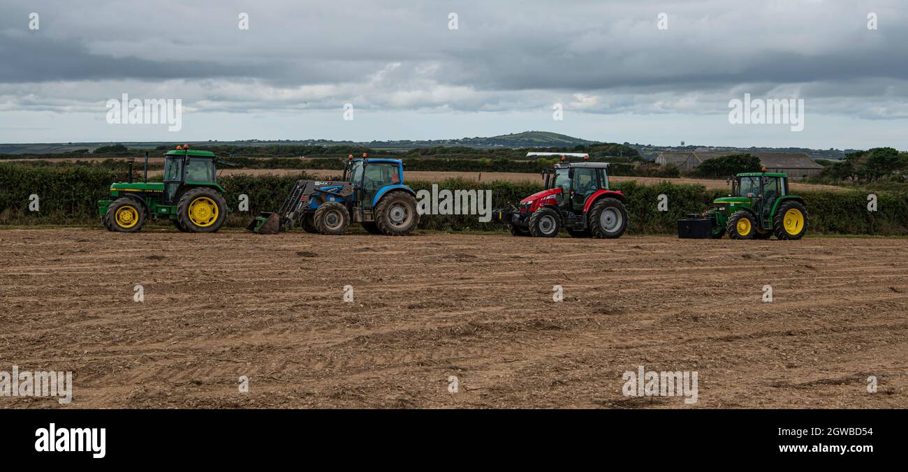 4 Tractors  in a Cornish field Stock Photo