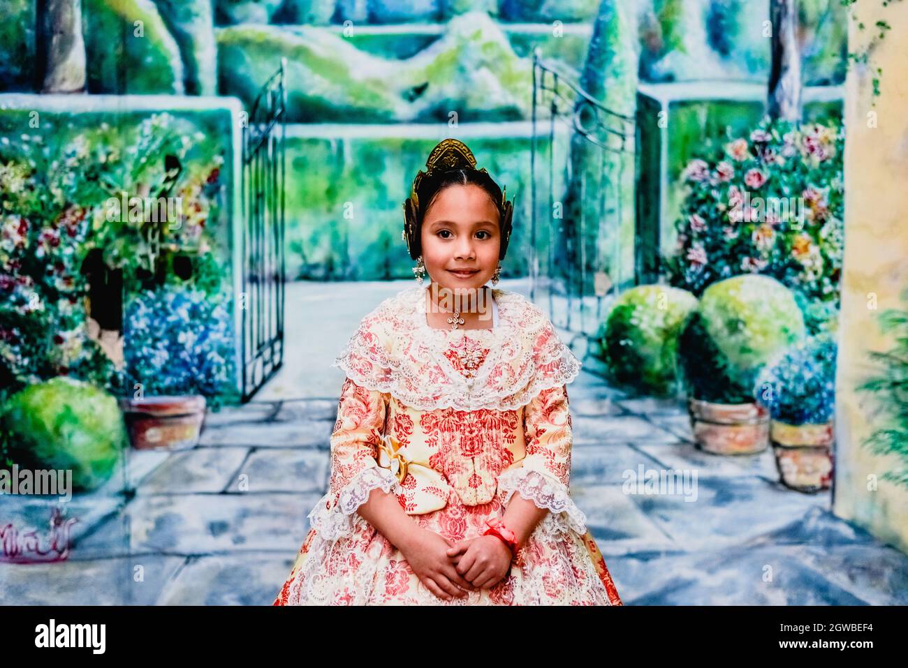 Portrait Of Smiling Girl Sitting Outdoors Stock Photo - Alamy
