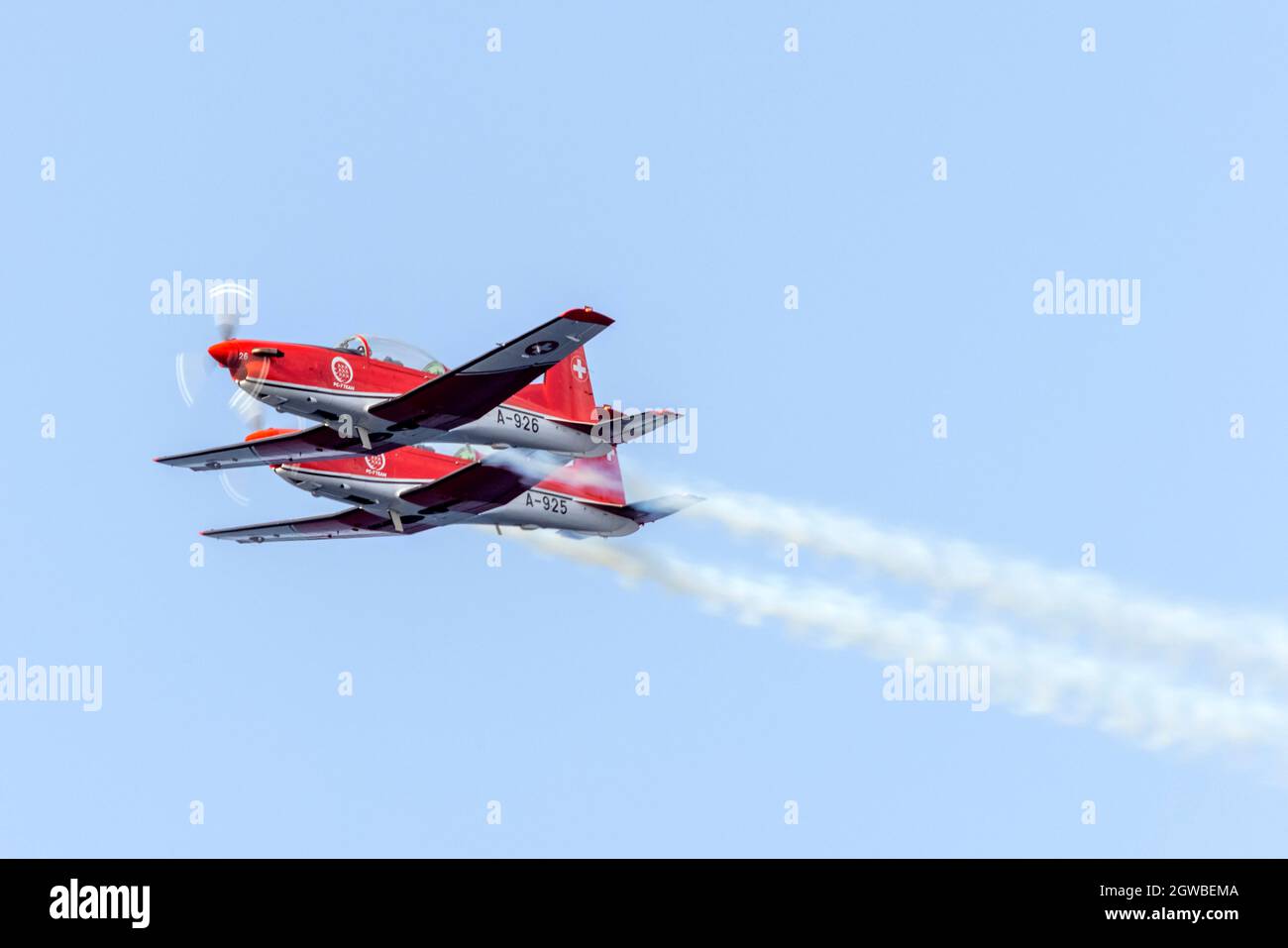 Swiss Air Force PC-7 team peforming their display over the sea. Stock Photo