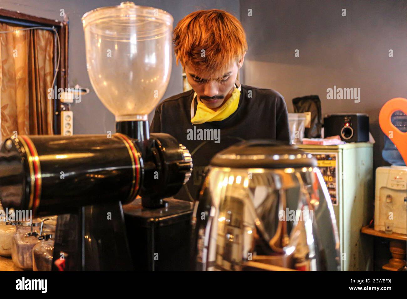 View Of Barista Working In Cafe Stock Photo
