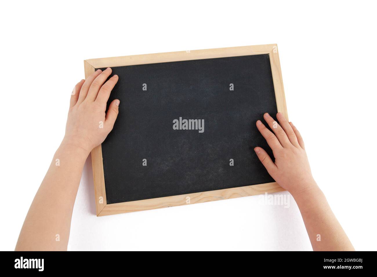 Top View Of Child Hands And Empty Chalkboard Isolated On White Stock Photo