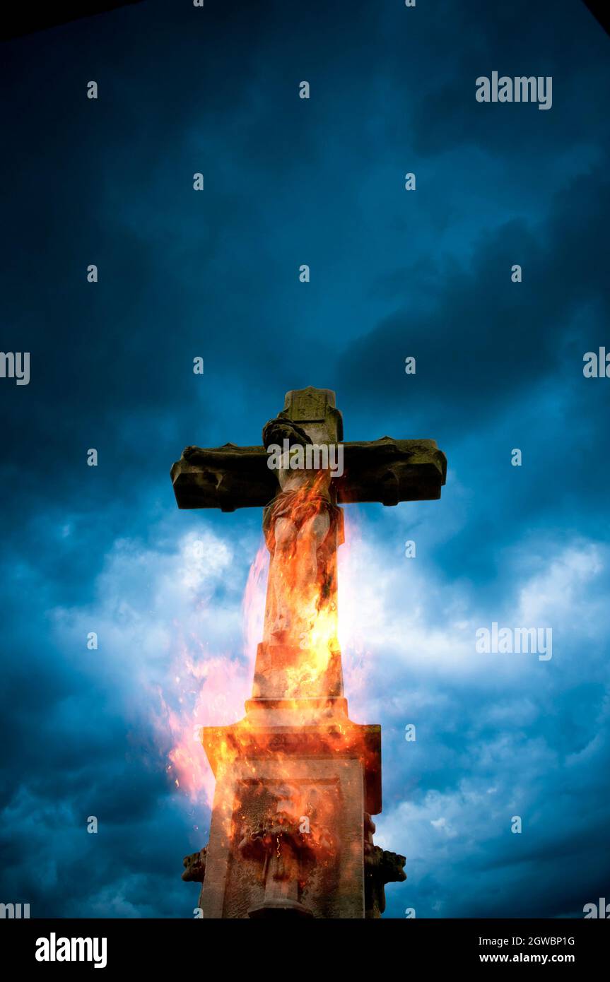 Christ on cross on fire Stock Photo Alamy
