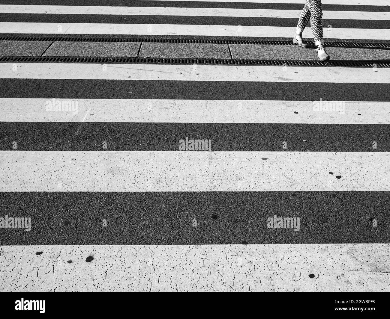 Pedestrian crossing road marking white Black and White Stock Photos
