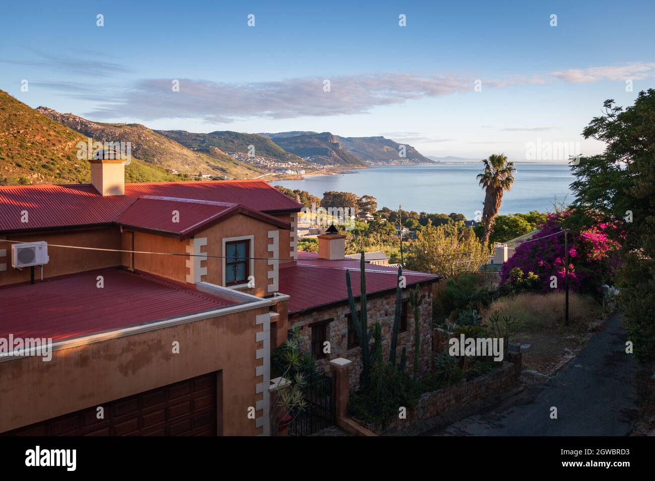 Scenic View Over Houses In Simons Town To False Bay And Kalk Bay In The Morning Stock Photo