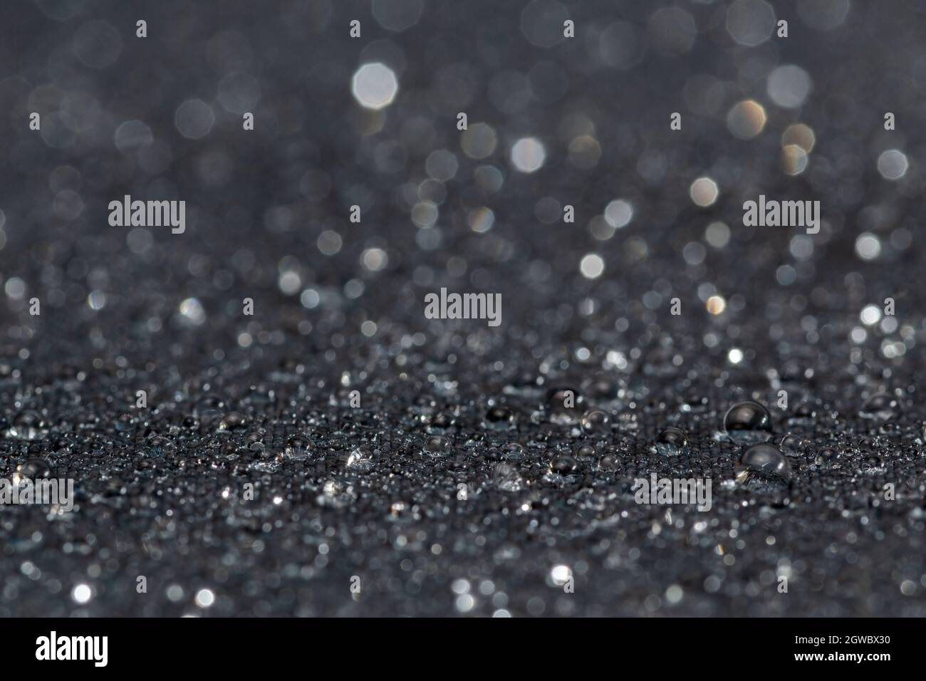Full Frame Shot Of Raindrops On Gray Waterproof Hydrophobic Coated Cloth Close Up Stock Photo