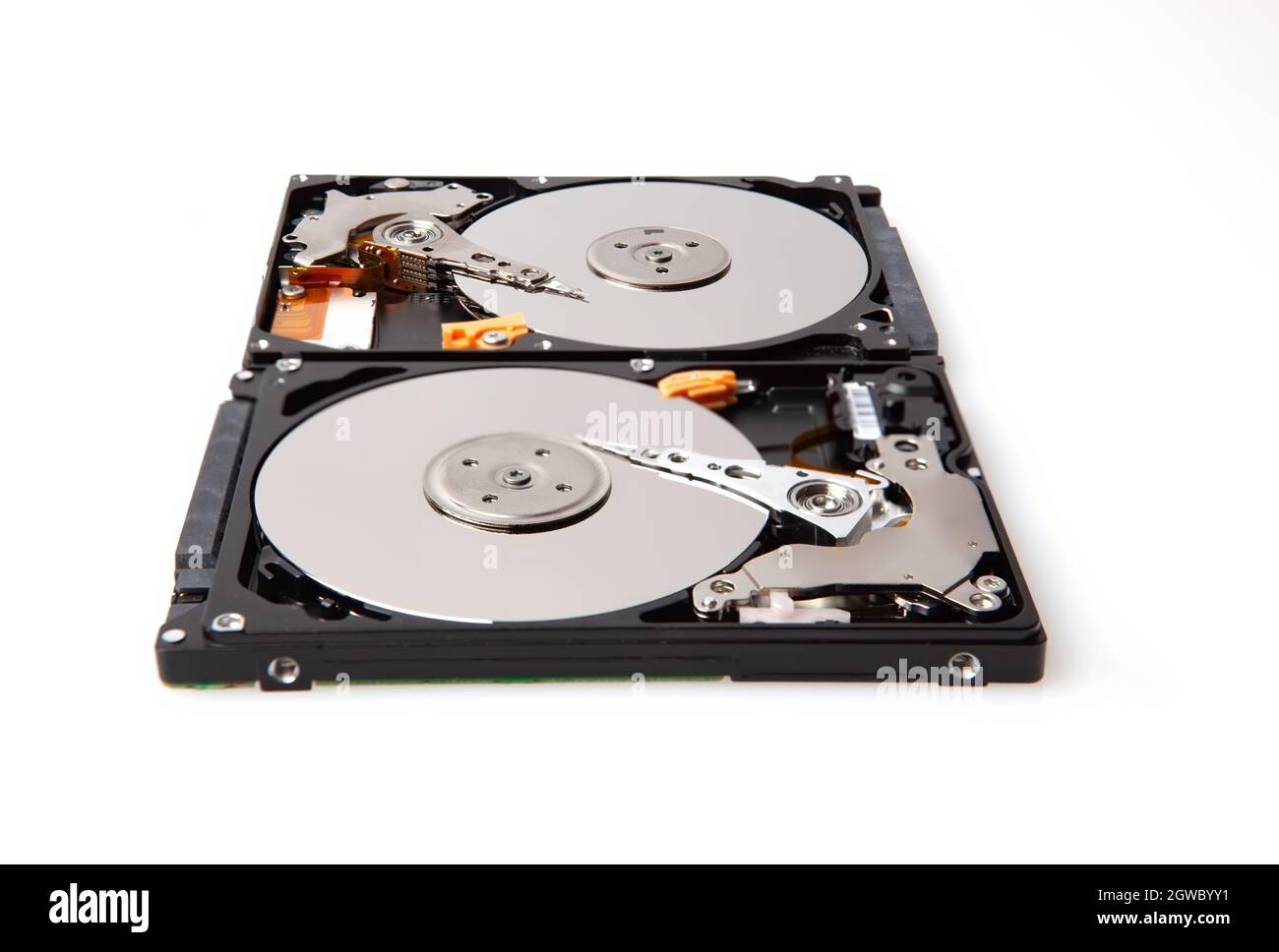 Two Hard Drives Isolated On White Showing Their Internal Components - 2.4 Inch Hdd Stock Photo