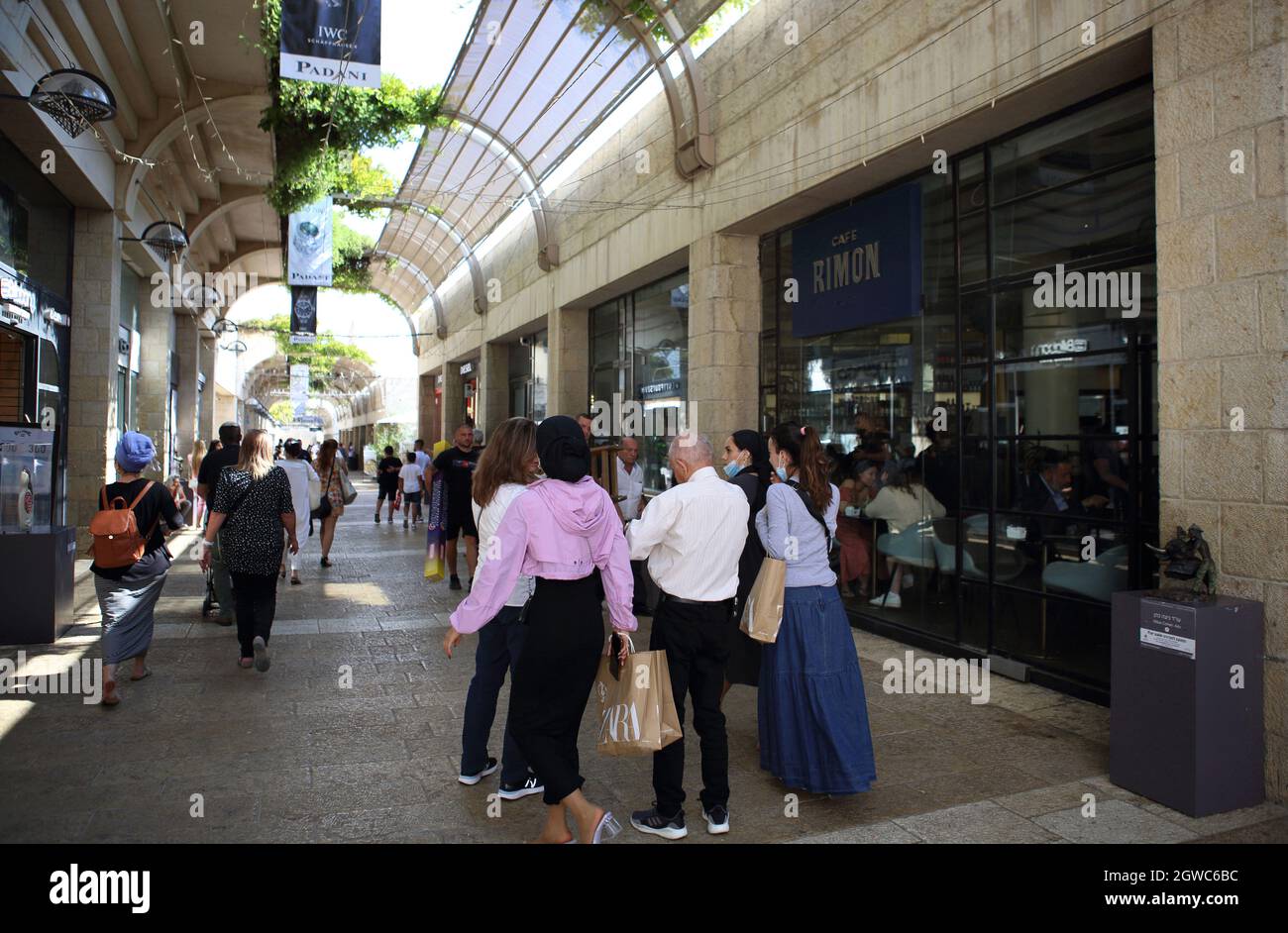 Shoppers, some with face masks due to corona, walk in the almost empty Mamilla Mall or Alrov Mamilla Avenue near Jaffa Gate to Jerusalem Old City. Stock Photo