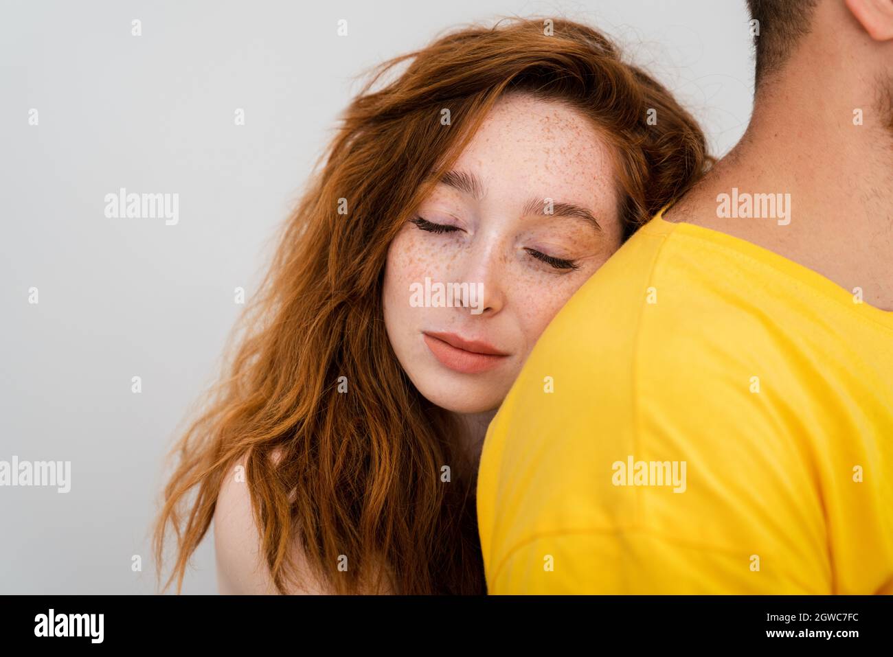 A couple loves eachother and woman lays her head to mans shoulder. . High quality photo Stock Photo