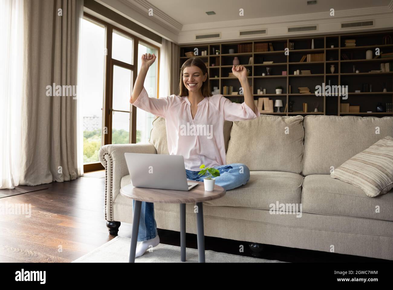 Happy excited student girl celebrating success at laptop at home Stock ...
