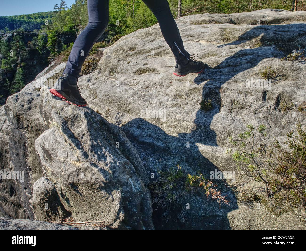 Fitness Man Trail Runner Running To Rocky Mountain Top On Cracked Rocky  Block Stock Photo - Alamy