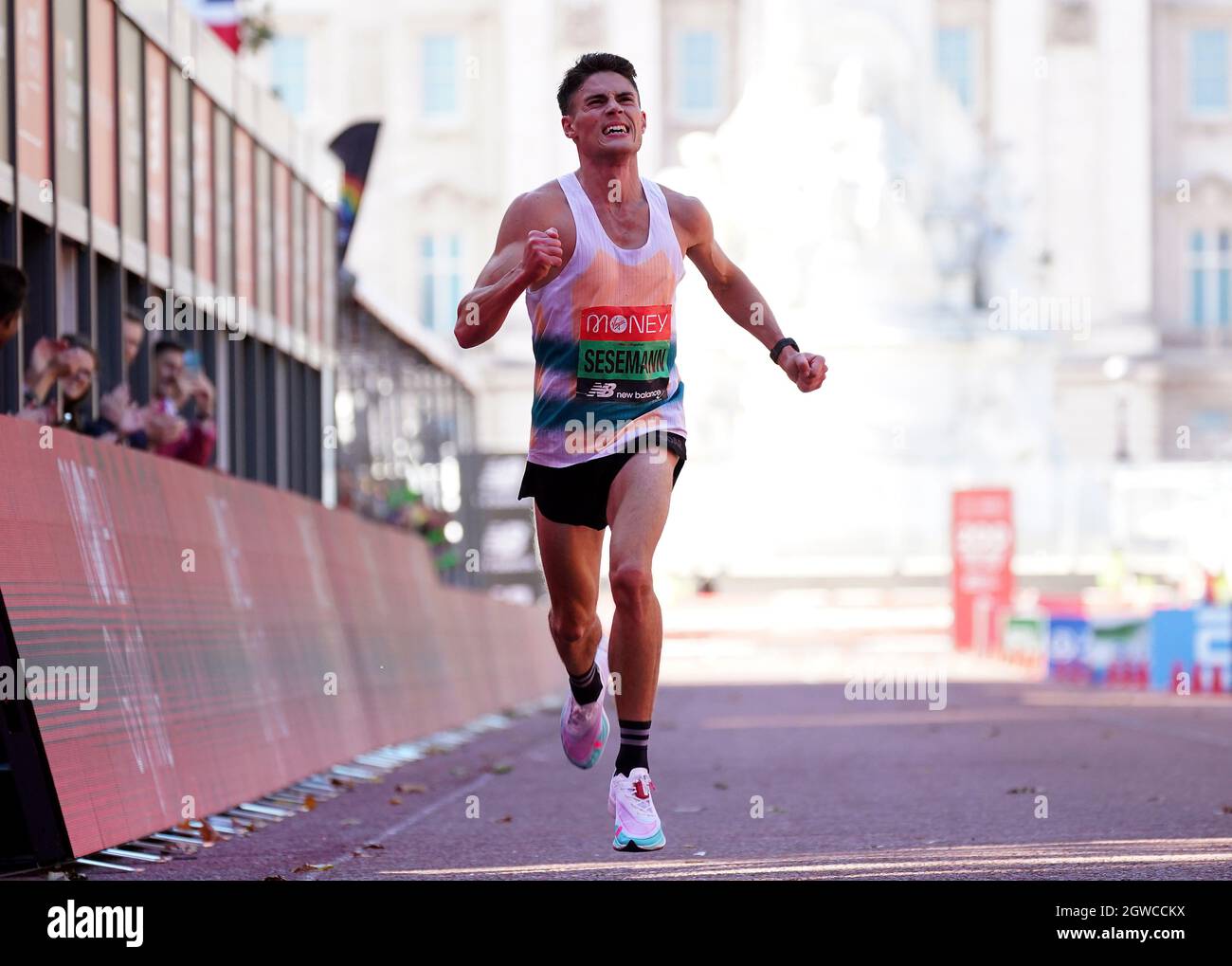 Phil Sesemann crosses the line to finish 7th in the Men's elite race during  the Virgin Money London Marathon. Picture date: Sunday October 3, 2021  Stock Photo - Alamy