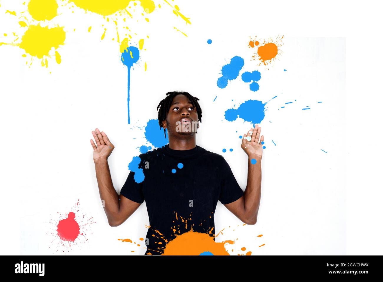 Man With Splash Of Colors Stock Photo - Alamy