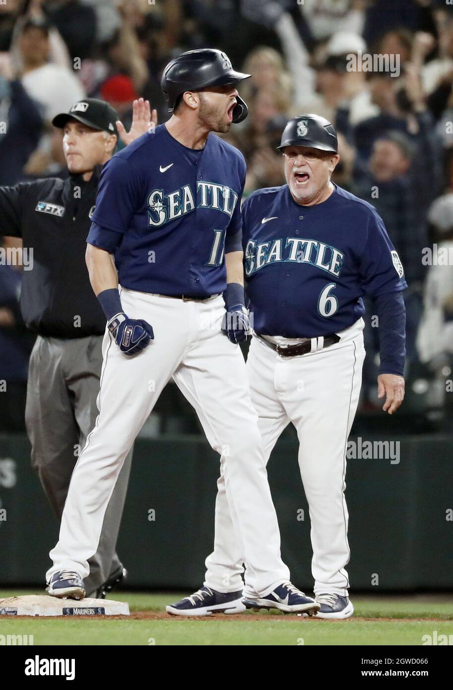 Mitch Haniger of the Seattle Mariners reacts after hitting a two-run single  in the eighth inning of a game against the Los Angeles Angels on Oct. 2,  2021, at T-Mobile Park in
